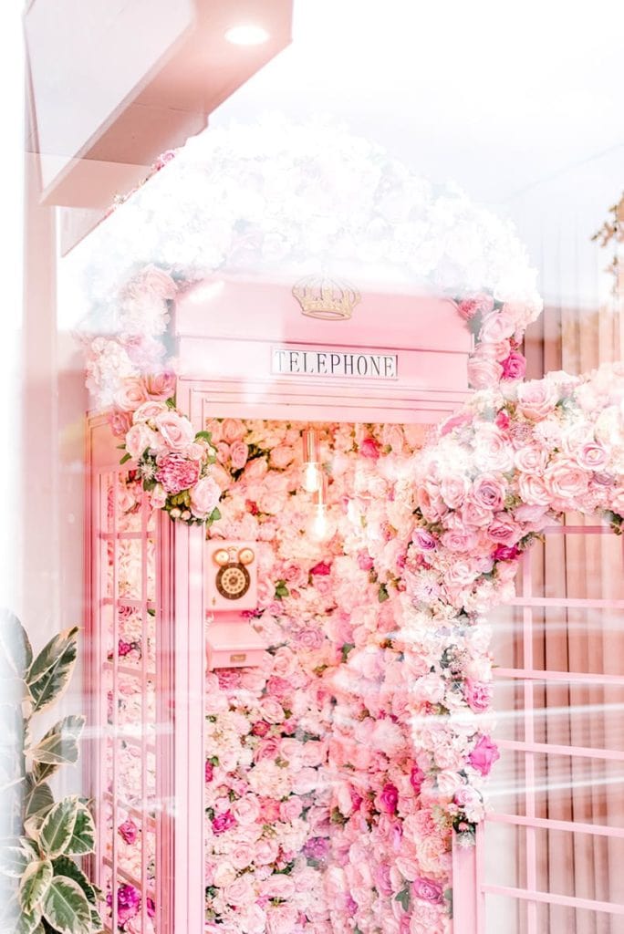 pink floral phone booth lash spa